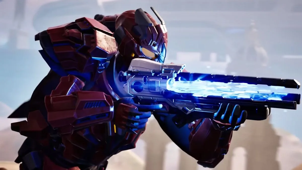 A Tribes 3 soldier in red armour with their rifle raised all menacing like