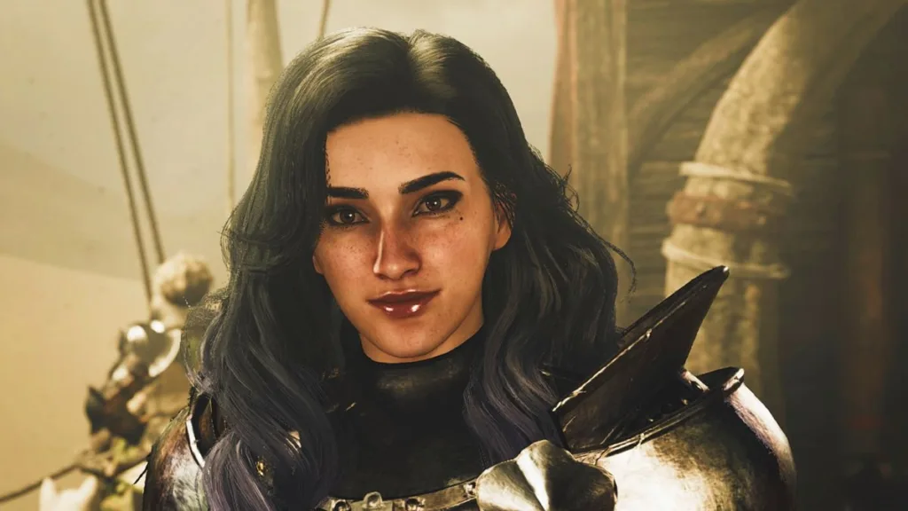 Una delle sorprese più piacevoli di Monster Hunter Wilds è quanto il mio Cacciatore chiacchieri 14 A female hunter with long black hair smiles slightly while looking towards camera.
