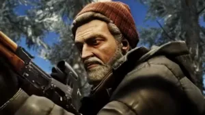 Escape from Tarkov, un uomo con la barba e il cappello ispeziona un fucile