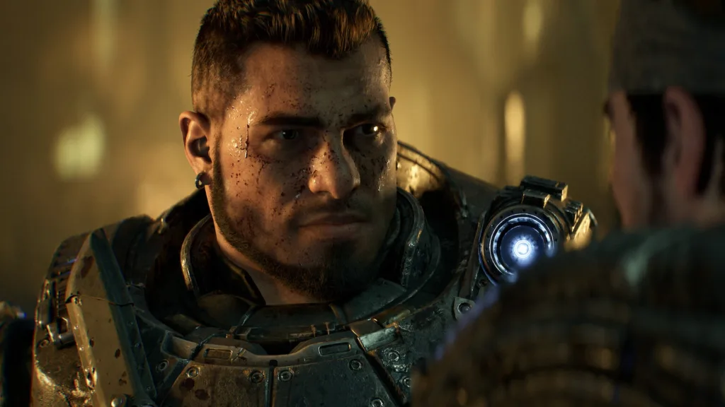 Primo piano di un soldato in armatura in una stanza in penombra in Gears of War: E-Day