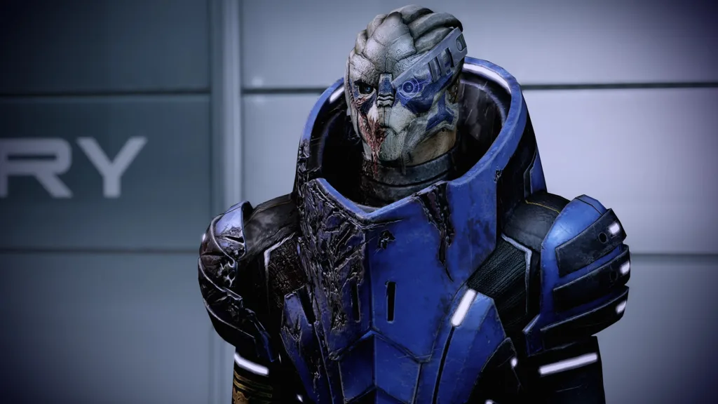 Il comandante Shepard di Mass Effect impugna un fucile accanto alla squadra