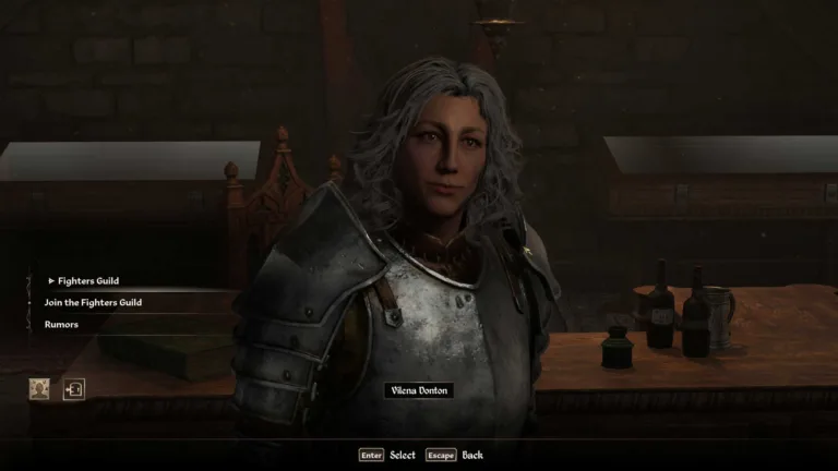 oblivion-remastered-fighters-guild-1-pcgamesn Un personaggio dai capelli grigi che parla in Oblivion Remastered.