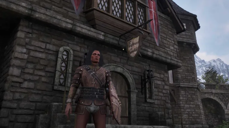 oblivion-remastered-fighters-guild-3-pcgamesn Un personaggio in piedi fuori da un edificio di pietra in Oblivion Remastered.