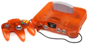 Un Nintendo 64 arancione con controller e cartuccia, la macchina su cui è uscito Super Mario 64